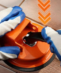 Hands using Floor Gap Fixer Tool For Laminate, Vinyl, Wood And Tile Floors - Adjustable Quick Lock And Release Repair Tool, Bright Orange