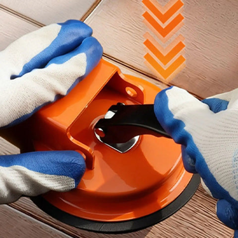 Hands using Floor Gap Fixer Tool For Laminate, Vinyl, Wood And Tile Floors - Adjustable Quick Lock And Release Repair Tool, Bright Orange