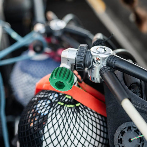 Heavy Duty Stainless Steel Scuba Valve Handle Replacement Wheel For Diving Cylinders, attached to diving gear in a net bag.