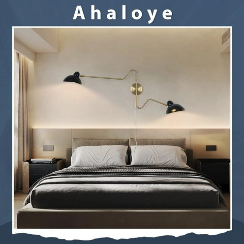 Modern bedroom with Plug In Black Wall Sconce With Swing Arm And 360 Degree Rotatable Shade On Off Cord Switch above bed.