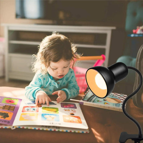 Gooseneck Clip On Desk Lamp With 360 Degree Rotation Easy Clip On Reading Light illuminating a child reading a book.