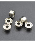 RC Car Bearings Upgrade Kit 1.5x4x2mm 681X ZZ Shielded Mini Ball Bearings 10 Pack Dope Upgrade Parts For Smooth Spin Precise Tuning And Easy DIY RC Upgrades. Image shows tiny silver ball bearings arranged on a dark surface, emphasizing their compact size and shielded design.