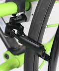 Close-up of Dual Composite Scissor Wheel Lock Set For Wheelchairs attached on green sports wheelchair frame.