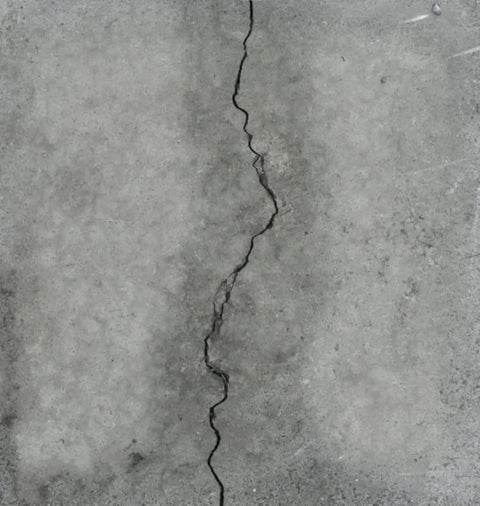 Close-up of a cracked concrete surface suitable for LCR Epoxy Concrete Crack Repair Kit Stop Leaks With High Performance Structural Bonding