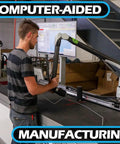 Technician using computer-aided machine for precision manufacturing in workshop.