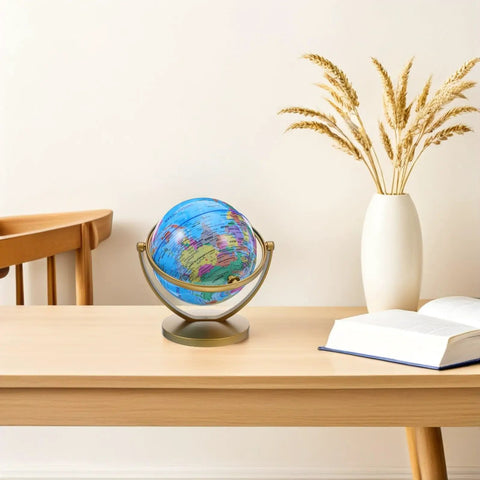 Rotating Desktop Globe With Stand 14.2cm Blue Frame Educational World Sphere on desk with book and vase