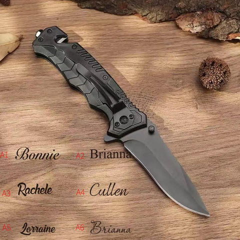 Black Serrated Folding Knife With Dual Edge Design placed on wooden background, showing closed blade and textured handle