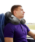 Man using Elephant On Wood Travel Pillow With Memory Foam Neck Support U Shape Portable Neck Pillow For Planes Trains Cars