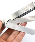 Stainless steel 32-piece feeler gauge with SAE/metric blades, offset valve thickness gauge, held in hand.