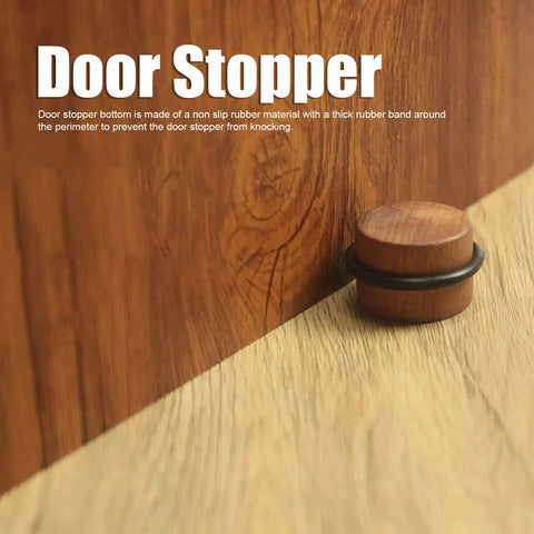 Solid Wood Cylindrical Door Stopper With Rubber Ring Heavy Duty Floor Protector next to a wooden door on wood flooring