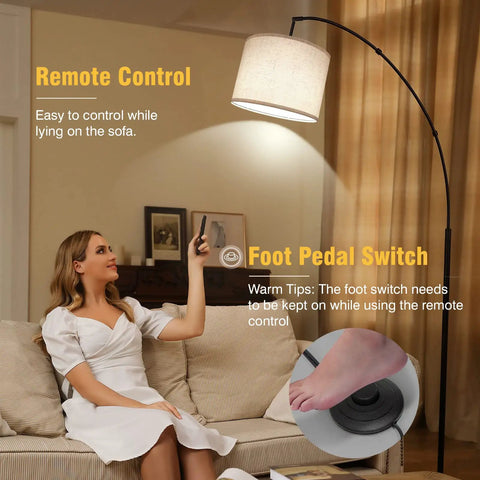 Lit Tall Arc Floor Lamp With Remote Control 81 Inch Tall Dimmable LED with drum beige shade over beige sofa.