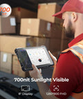 Person using Rugged Barcode Tablet With Zebra SE4710 Scanner, Android 14 in a warehouse with boxes, 8" display showing dashboard.