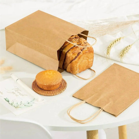 Kraft Paper Bags With Handles For Takeout And Shopping White 50 Pack 26x12x31 Cm Durable Versatile Bags with bread and muffin displayed