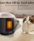Portable Mini Space Heater 500W with Overheat and Tip Over Protection next to a cat on a carpeted floor
