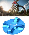 Biking on mountain trail with Aluminum Alloy Front Fork Valve Cover For Bike Suspension Airtight Blue Valve Cap Durable Accessory