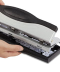 Heavy Duty 3 Hole Punch For Office Paper, sleek black and silver finish, shown with punched paper holes, durable metal construction.