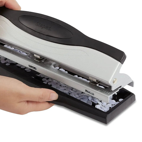 Heavy Duty 3 Hole Punch For Office Paper, sleek black and silver finish, shown with punched paper holes, durable metal construction.