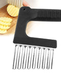 Close-up of black Kakalote crinkle cutter with stainless steel comb-like blade for potatoes and vegetables