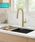 Spot Resistant Brushed Brass Pull Down Kitchen Faucet Featuring A Sleek High Arc Spout, installed above a granite workstation sink.