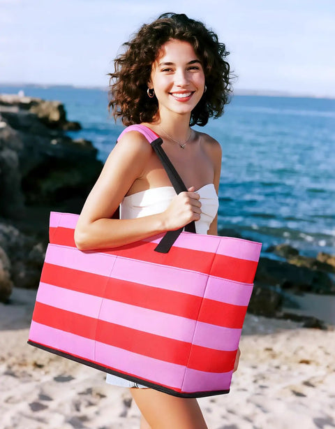 Woman holding 54L Beach Bag With Detachable Cooler, Waterproof And Sandproof Duffle Tote For Women, Pink, on a sandy beach