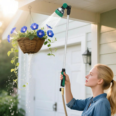 Person using 30 Inch Garden Hose Wand With 10 Spray Patterns And Thumb Control on hanging basket, ergonomic grip, in garden setting.