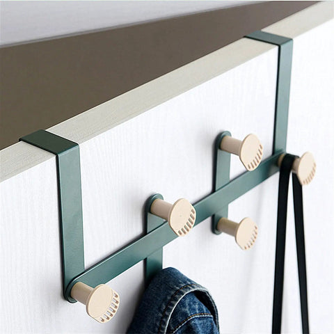 Slick Wall Mounted Coat Hooks And Door Hanging Multi Rack Heavy Duty Storage Easy Peasy Setup For Bedrooms Bathrooms Closets To Keep Life Dang Tidy And Super Neat features green metal frame with cream hooks holding a jacket.