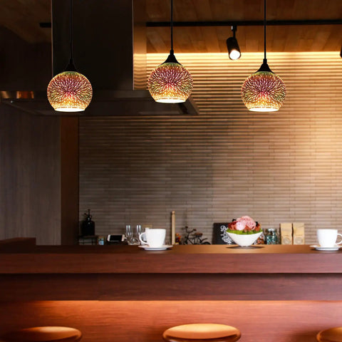 Set of 3 Modern Glass Pendant Lights With Colorful 3D Firework Design over kitchen island, creating vibrant ambiance.