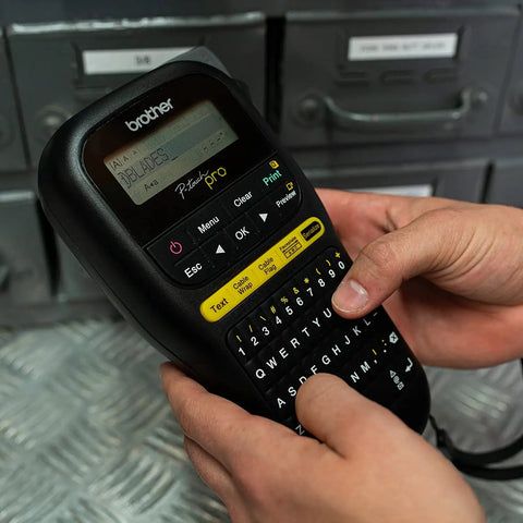 Knockout Performance P Touch Pro Label Maker equipped with one touch keys, handheld design, displaying text input for electrical labeling.