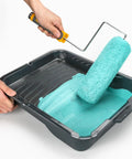 Person using Six Pack Nine Inch Lambswool Paint Roller Covers With Three Quarters Inch Nap High Capacity Fits US Standard Nine