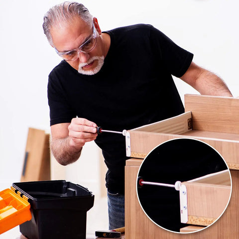 User installing Game Changing 16 Piece 19 Mm Three Quarter Plastic Drawer Rollers With Precision Ball Bearing for cabinets.