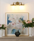 Two-Head Brass Wall Sconce Light With Flower Design Vintage Mid Century Style Vanity Lamp for bathroom above artwork and flowers