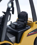 Mini Warehouse RC Forklift Model 9925 With Realistic Light And Sound Effects Precise Steering Lift Lower Function Plus Remote Control Operation For Indoor Play interior seat detail showing compact design and realistic controls.