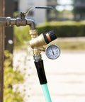 RV water pressure regulator valve with gauge; lead-free brass body, adjustable knob, 3/4-inch connector, hose in front view