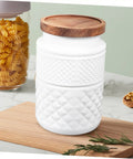 Two Pack Glass Storage Jars With Secure Airtight Lids For Coffee Beans And Dry Goods Keeps Your Stash Locked Down Tight Vintage Embossed Decorative Kitchen Canisters You Need on a wooden surface with pasta in the background.
