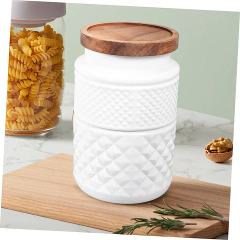 Two Pack Glass Storage Jars With Secure Airtight Lids For Coffee Beans And Dry Goods Keeps Your Stash Locked Down Tight Vintage Embossed Decorative Kitchen Canisters You Need on a wooden surface with pasta in the background.