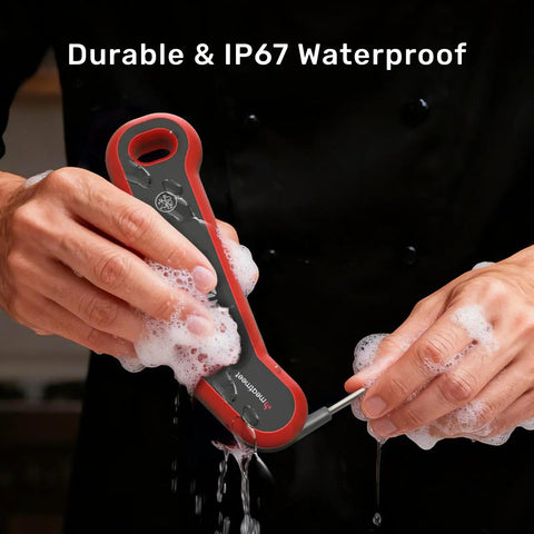 Hands washing an Instant Read Digital Meat Thermometer With Lightning Fast 0.5 Second Response, IP67 Waterproof, with soap bubbles.