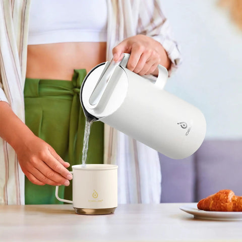 Person pouring from Real Deal Thermal Coffee Carafe Holds Fifty Ounces Advanced Vacuum Insulated Stainless Steel Beverage Dispenser.