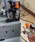 Pro Grade Tire Changer Air Compressor Regulator Kit With Water And Oil Separator in use with pressure gauge on machine