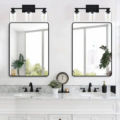 Double vanity with three light black vanity light bar with rotating track heads and clear glass shade, matte black modern vanity lighting.
