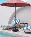 Beefy 70 Lb Weight Heavy Duty Water Fillable Umbrella Base Stand For Patio And Market Tables with red umbrella by poolside