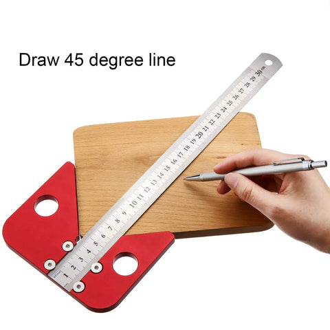 Aluminum Alloy Center Finder Square With 45 Degree Angle Guide Dead Center Layout Tool For Wood And Soft Metal Marking No Fuss Precision Scribing Ruler on wooden surface with a hand holding a pen.