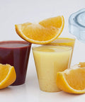 Juice glasses with oranges and a Lid Plug Replacement For Low Profile 64 Oz Blender Container Fits Pro750 Pro300.