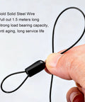 Hand holding steel drawstring of Retractable Door Closer No Drill 1200g Tension With Steel Drawstring For Sliding Glass Screen Doors
