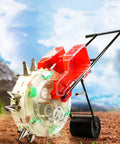 Walk Behind Garden Seeder Spreader With Eight Seed Plates And Dual Buckets For Lawn And Farm on tilled soil background