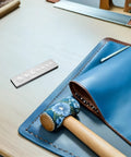 Top Notch 2-Piece Rivet Setting Tool With Durable Stainless Steel Base For Serious Crafters! This Cool 7-In-1 Multi Function Riveter Kit Makes Secure Fastening And Precision Alignment Super Easy On Metal, Leather, Or DIY Projects Without Breaking The. 2-piece stainless steel rivet setting tool and base on blue leather craft mat