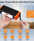 66800mAh Solar Power Bank Portable Charger With Hand Crank And 22.5W Fast Charge held in hand, demonstrating hand crank feature.