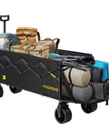 Heavy Duty Collapsible Wagon Cart With 440 Lbs Capacity loaded with camping gear, showing extended tailgate and all terrain beach wheels.