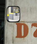 Wide Angle Convex Safety Mirror For Warehouse Parking Garage Driveway Blind Spot Coverage Beat Up Resistant Shell mounted on a wall.