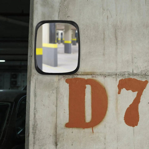 Wide Angle Convex Safety Mirror For Warehouse Parking Garage Driveway Blind Spot Coverage Beat Up Resistant Shell mounted on a wall.