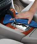 Person cleaning car interior with 90 Pack Blue Cotton Shop Towels 14 By 12 Inches Reusable Rags For Auto Garage Industrial And Home Cleaning.